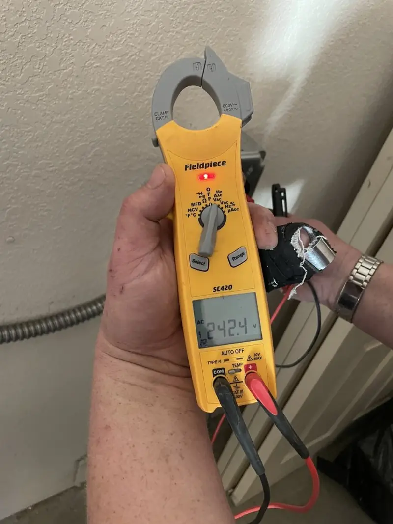 Voltage testing with clamp meter during Electrical Installation Services in Bayport